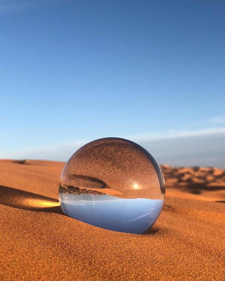 Sahara Majestic Luxury Camp Hotel Merzuga Kültér fotó A lensball in the desert